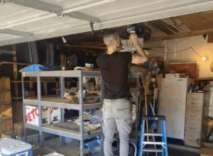 PLL technician installing a garage door opener