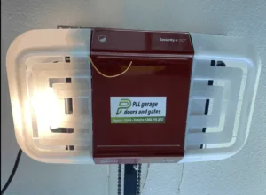 Garage door opener with PLL Garage Doors and Gates service sticker