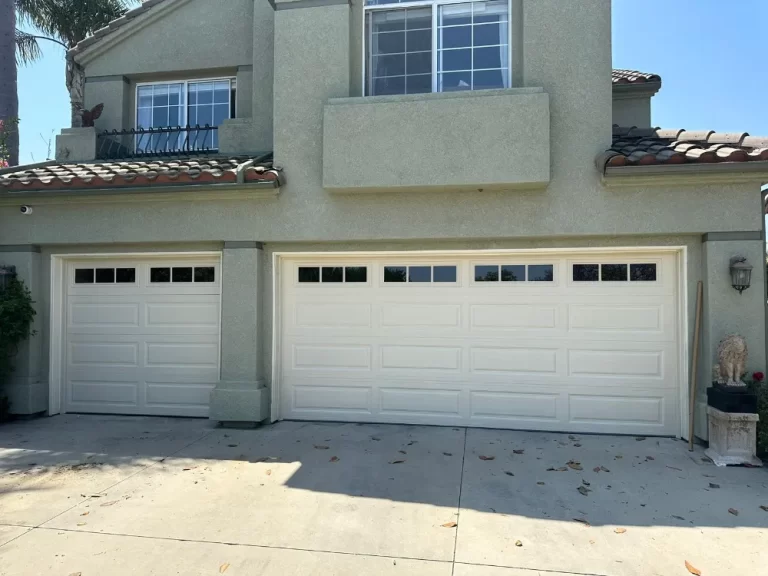 Two raised-panel garage doors with window tops, a PLL project