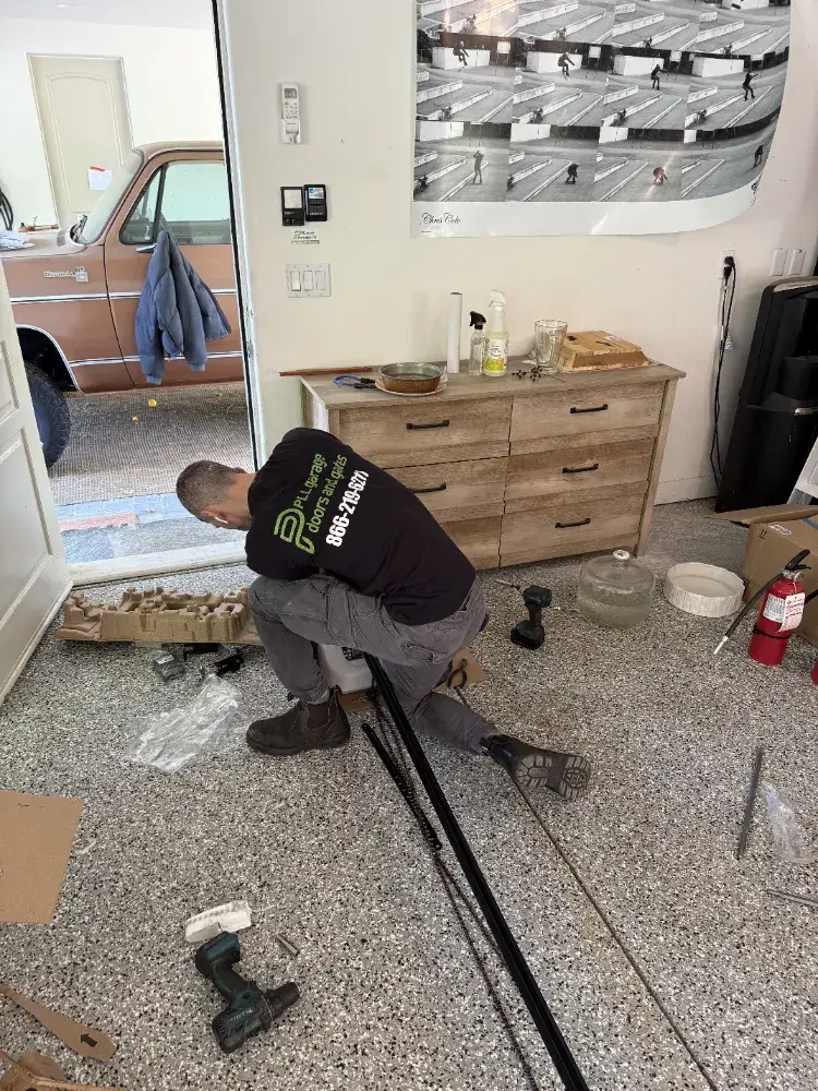 PLL technician assembling a garage door opener rail