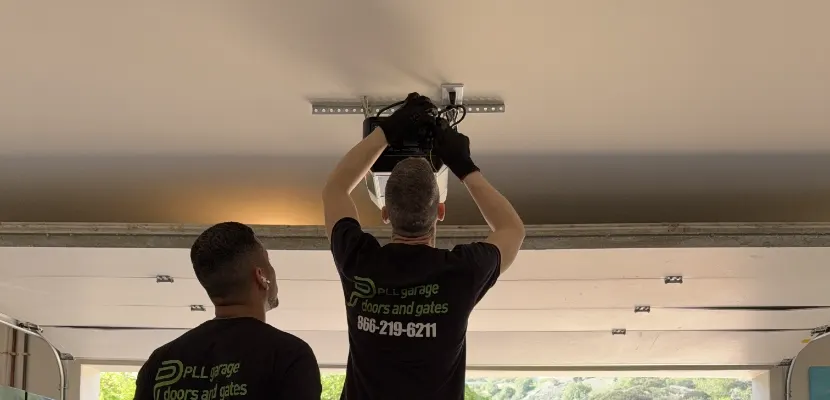 PLL technicians installing a garage door opener